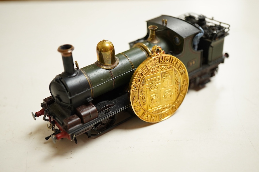An award winning EM gauge scratch built model railway locomotive by John Worsley, GWR Dean 0-4-4T, 34, rebuilt for the Woolmer Instructional Military Railway (later the Longmoor Military Railway), together with the medal